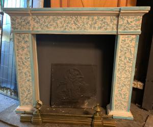 CHM903 - Ceramic fireplace with floral motifs, late 19th/early 20th century, measures 120 cm W x 102 cm H x 18 cm D